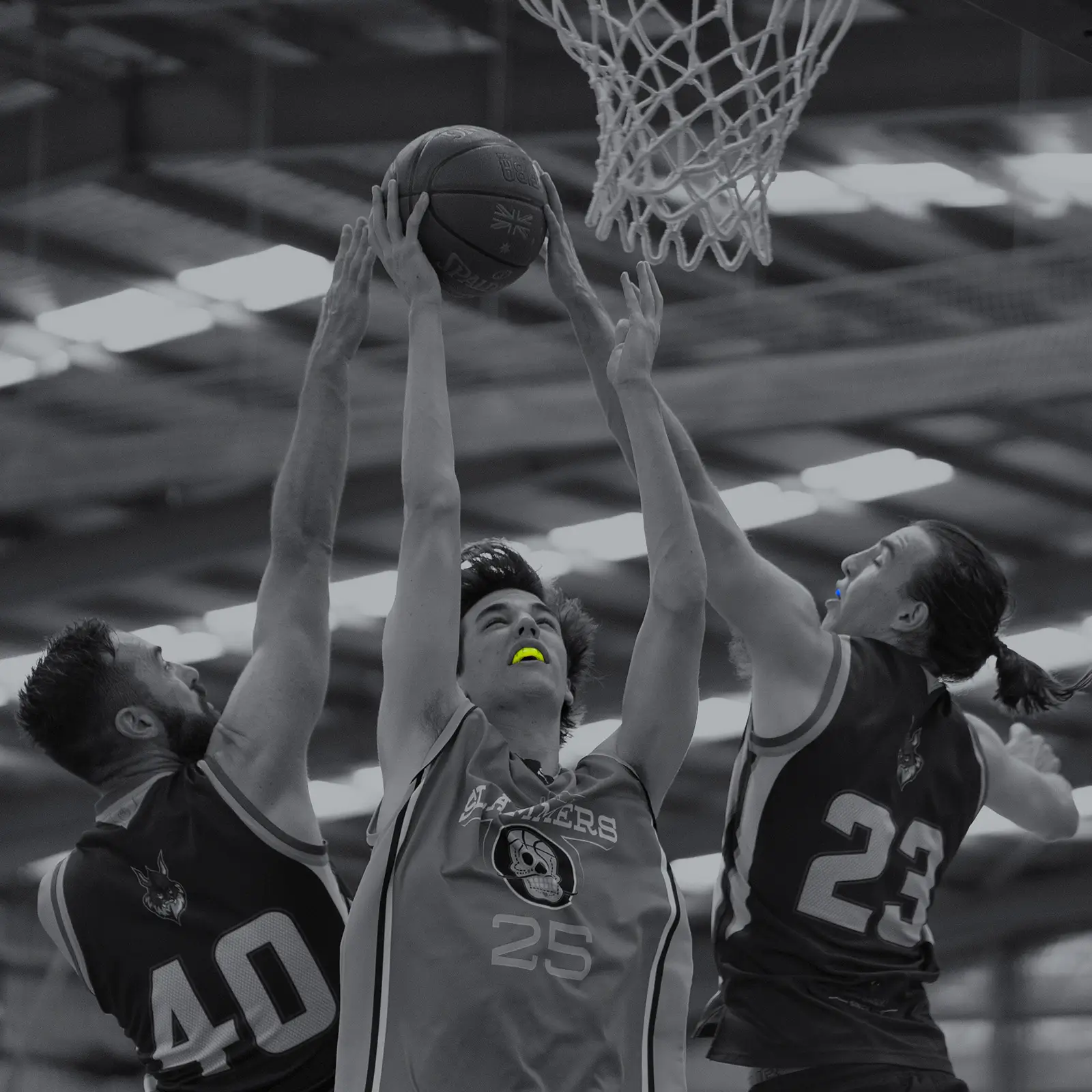 Male basketballer wearing Lime Green Neomorph mouthguard